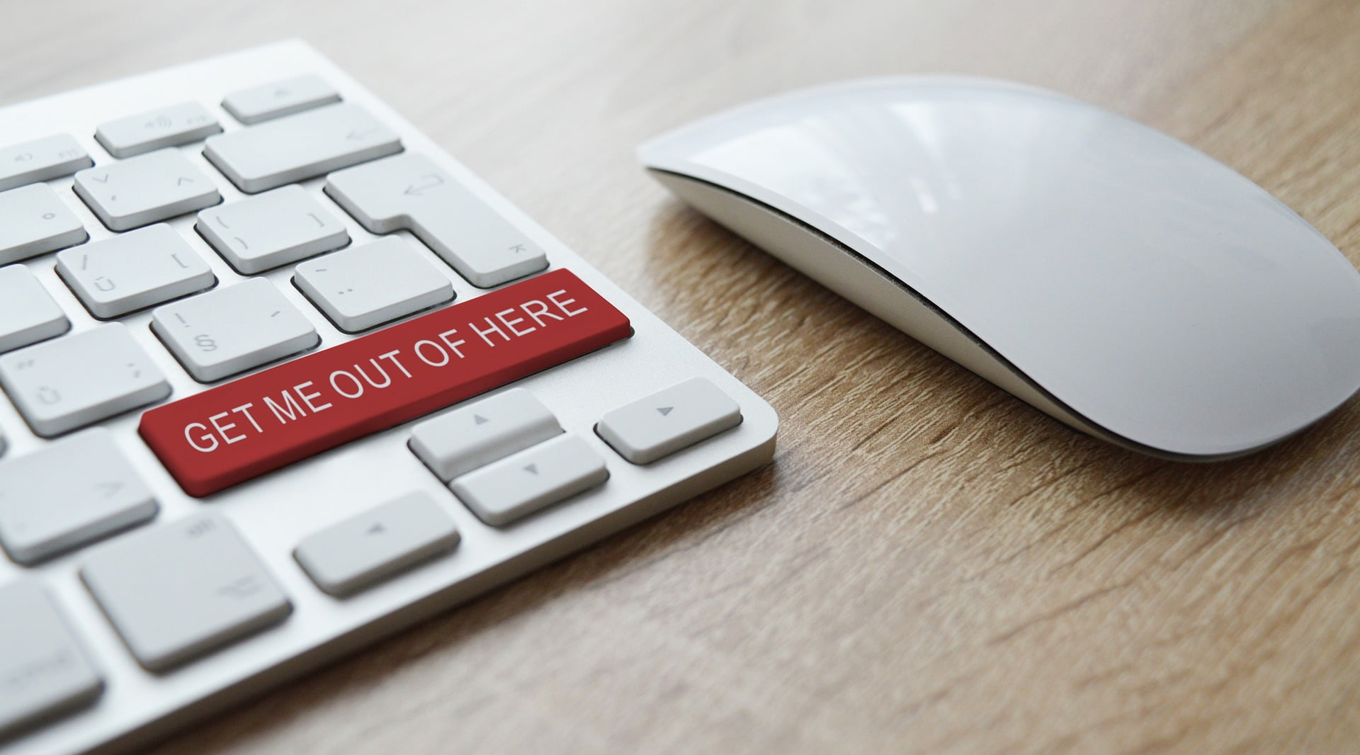 red computer keyboard button with the words "get me out of here" written on it